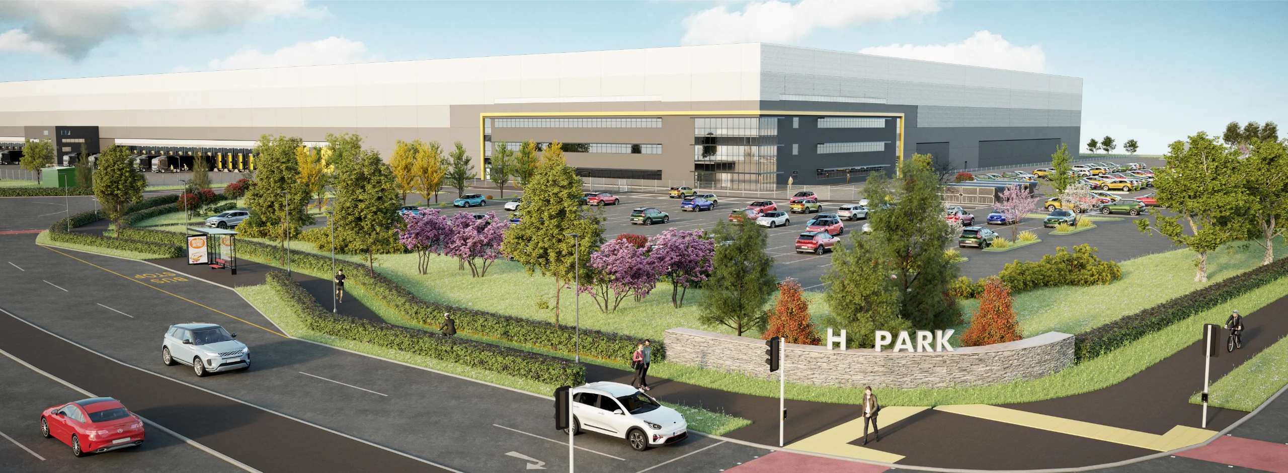 Modern industrial facility with parking and greenery